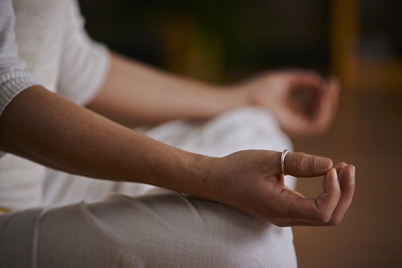Woman meditating in yoga pose